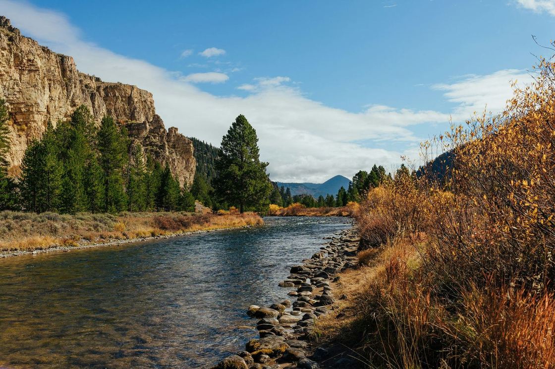A river winding through a Montana valley at golden hour